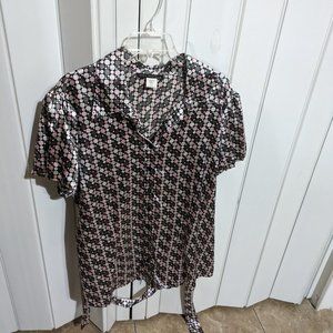 Women's blouse with a fabric belt for around the waist.